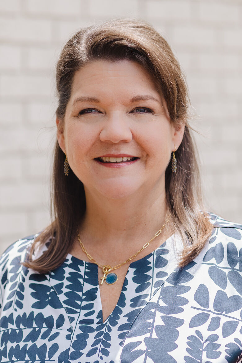 Therapist Jacquie Atkins smiling at the camera.
