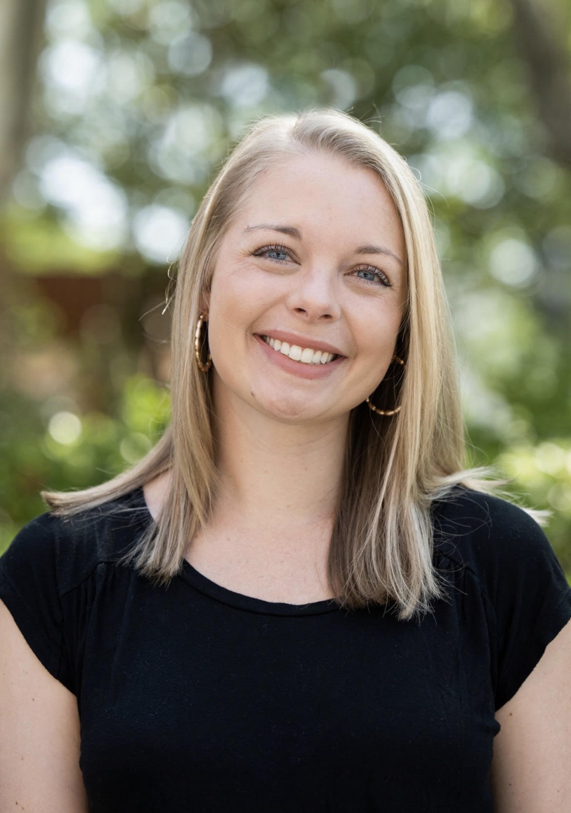 Therapist Carly Polk smiling at the camera.