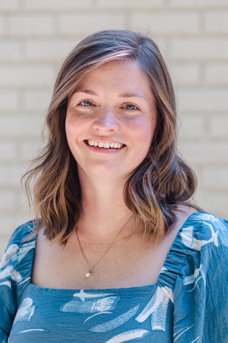 Therapist Sydney Reynolds smiling at the camera.